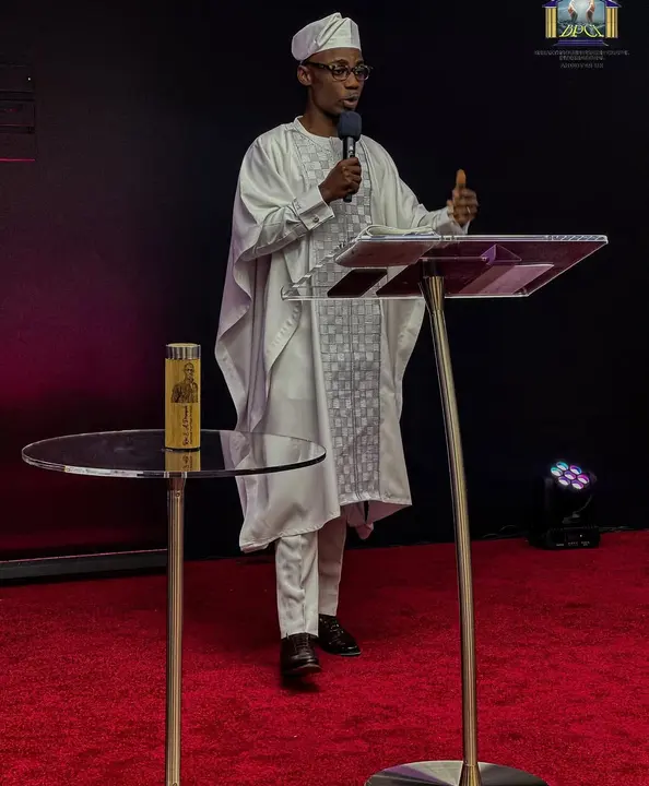 White agbada, worn on stage